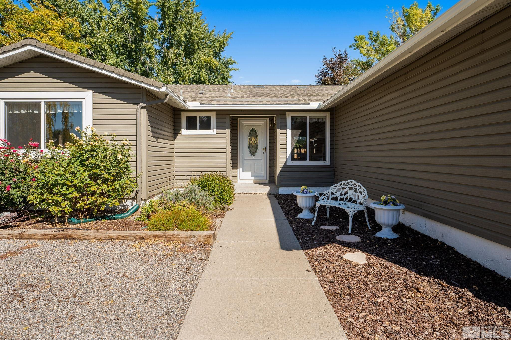 4315 Mendocino Lane Reno, NV 89502 - Photo 4 of 31 a view of a house with a small yard and a patio
