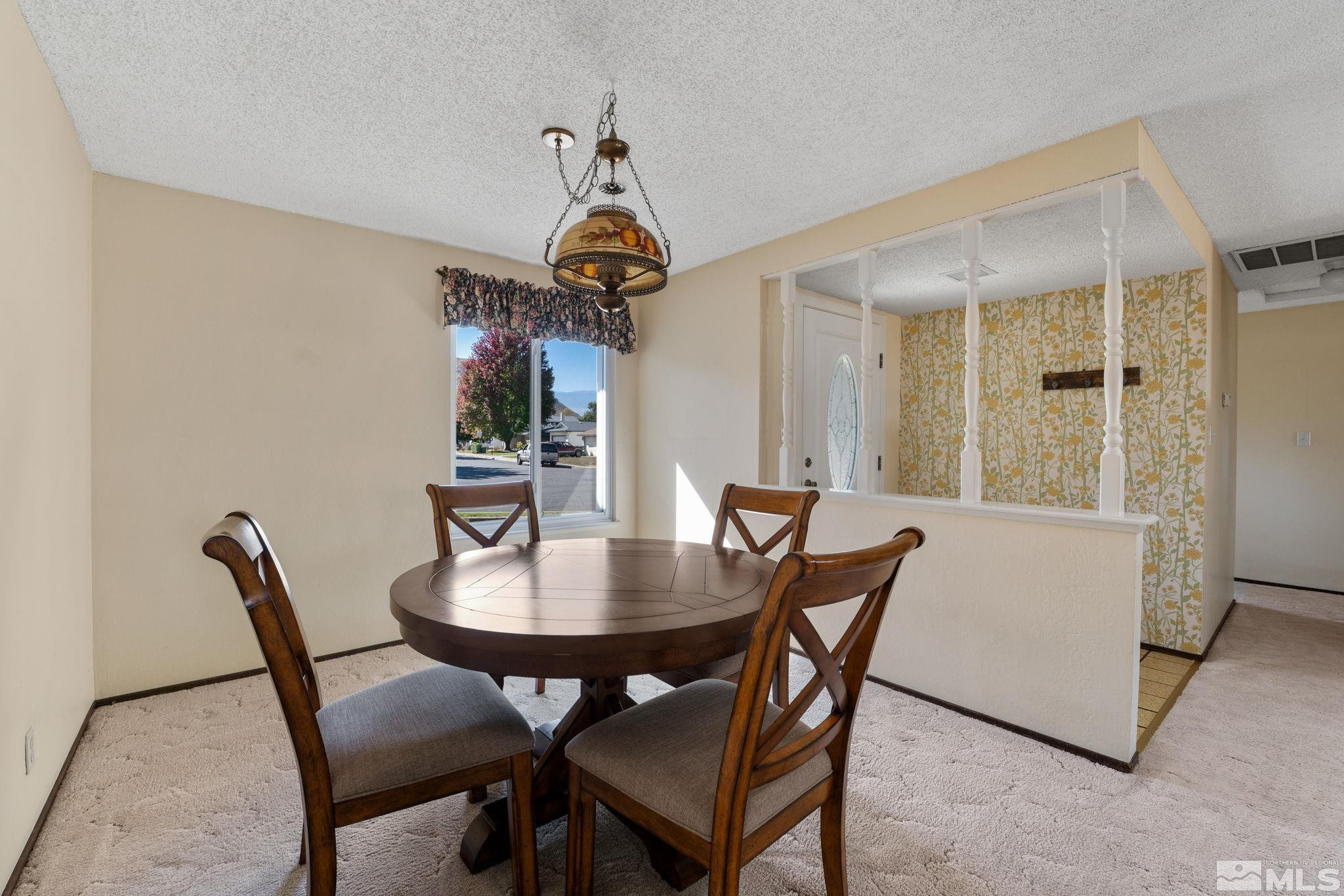 4315 Mendocino Lane Reno, NV 89502 - Photo 10 of 31 a view of a dining room with furniture window and wooden floor
