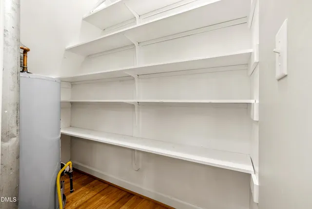 a kitchen with stainless steel appliances granite countertop a sink and a large window