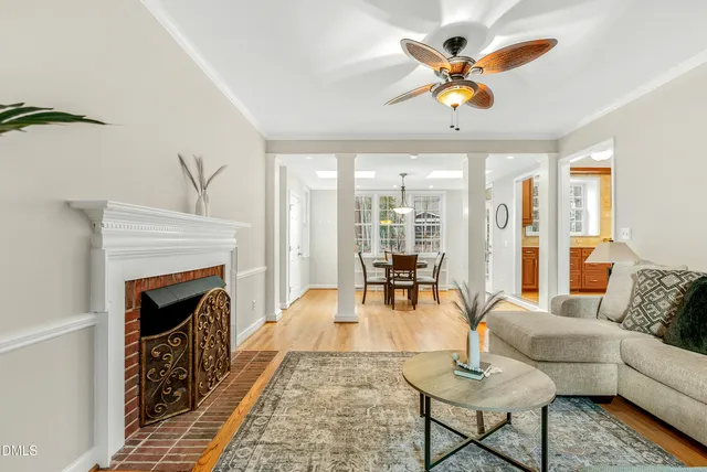 a dining room with furniture and wooden floor
