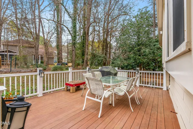 a view of a backyard with plants and a slide