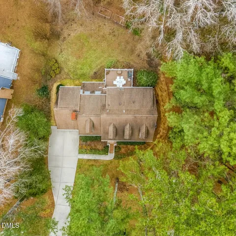 a view of a deck with furniture and trees