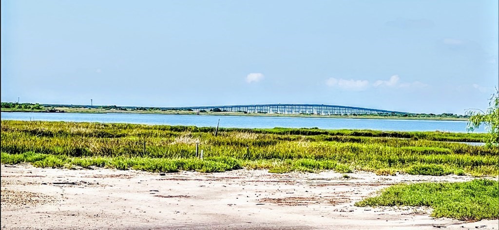 74 Newcomb Bend Loop Rockport, TX 78382 - Photo 5 of 31 a view of a lake with a beach