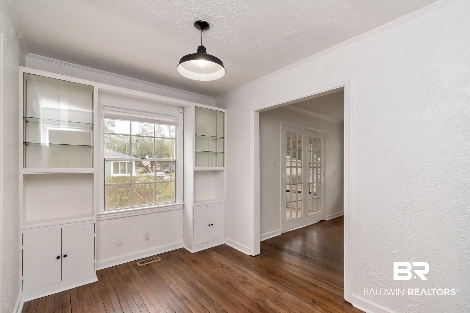 208 Morgan Avenue Mobile, AL 36606 - Photo 9 of 27 Unfurnished dining area with dark hardwood / wood-style floors and crown molding