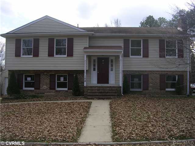108 Tudor Road Colonial Heights, VA 23834 - Photo 1 of 12 a front view of house with yard