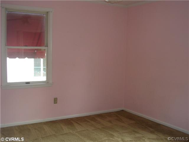 108 Tudor Road Colonial Heights, VA 23834 - Photo 5 of 12 a view of a small space with wooden floor and a window