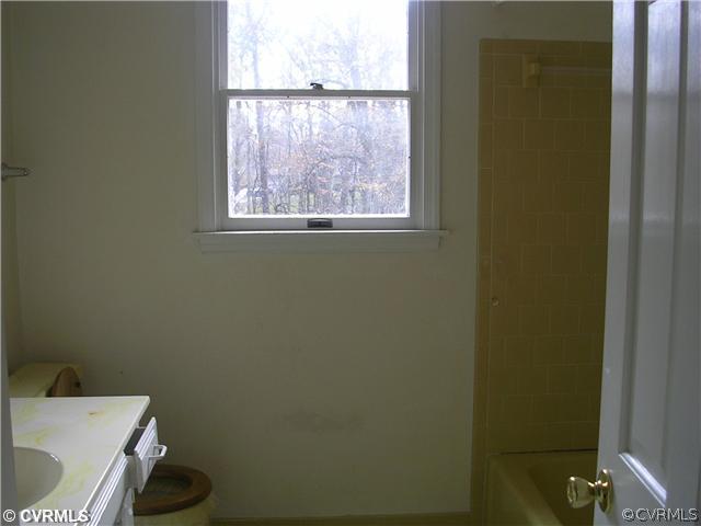 108 Tudor Road Colonial Heights, VA 23834 - Photo 7 of 12 a bathroom with a toilet and a sink