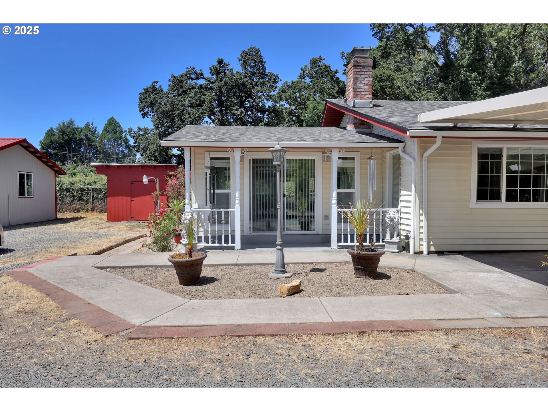 4705 Jasper Road Springfield, OR 97478 - Photo 3 of 48 a view of a house with backyard sitting area and garden