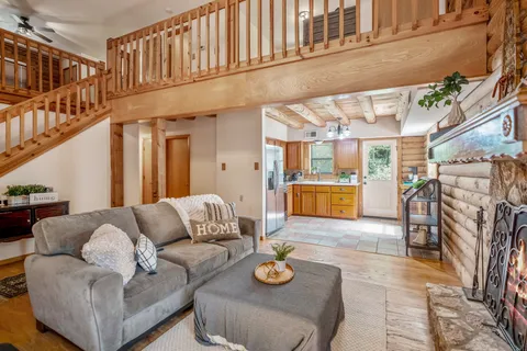 a living room with furniture and a rug
