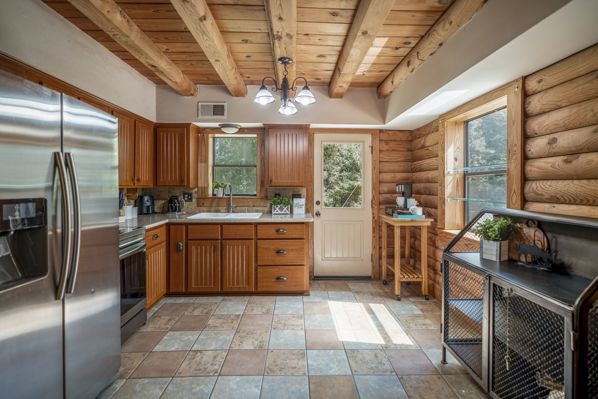 31370 Lazy Ridge Drive Waller, TX 77484 - Photo 15 of 43 a kitchen with stainless steel appliances granite countertop a stove a refrigerator a sink and dishwasher