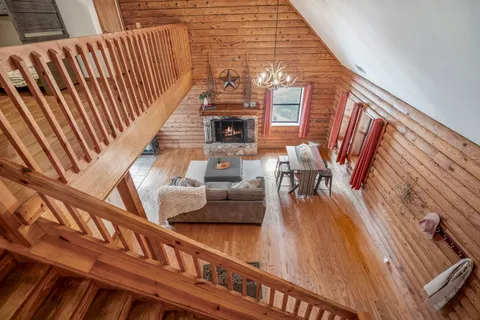 a bedroom with furniture and a window