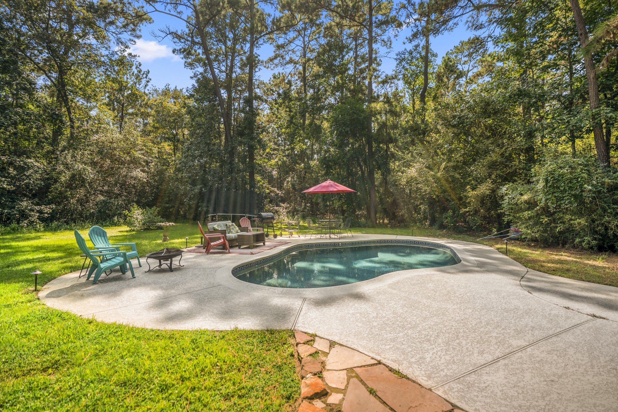 31370 Lazy Ridge Drive Waller, TX 77484 - Photo 36 of 43 a view of a swimming pool with a yard and sitting area
