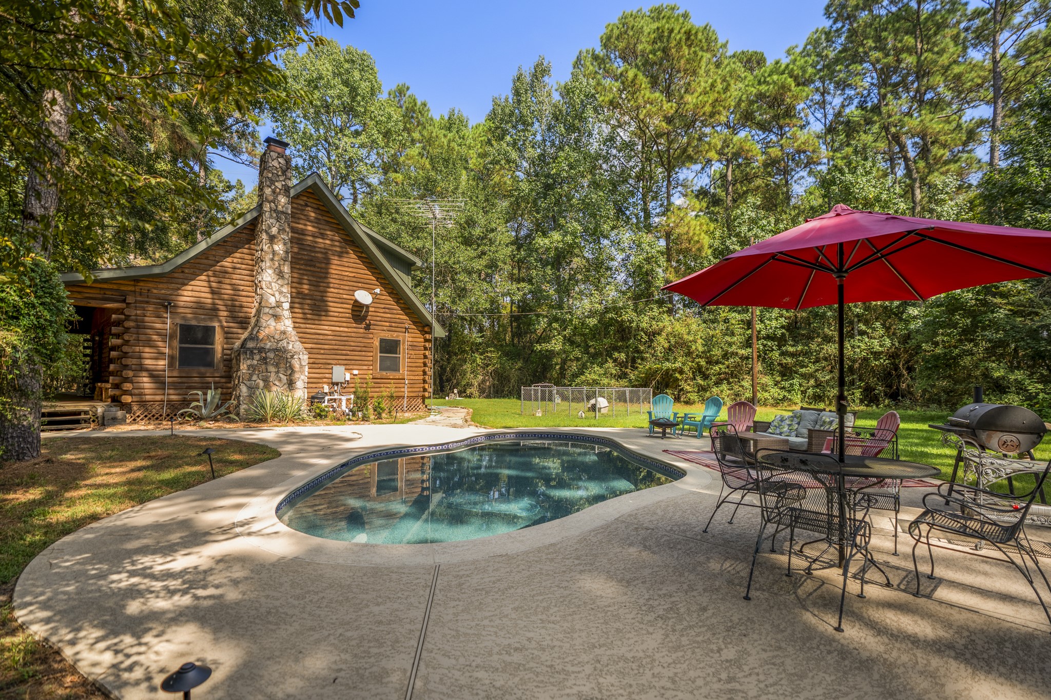 31370 Lazy Ridge Drive Waller, TX 77484 - Photo 38 of 43 a view of a house with backyard and sitting area
