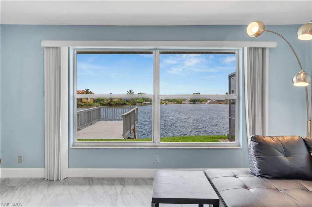 3065 50th Lane Southwest Naples, FL 34116 - Photo 21 of 31 a room with furniture and a window