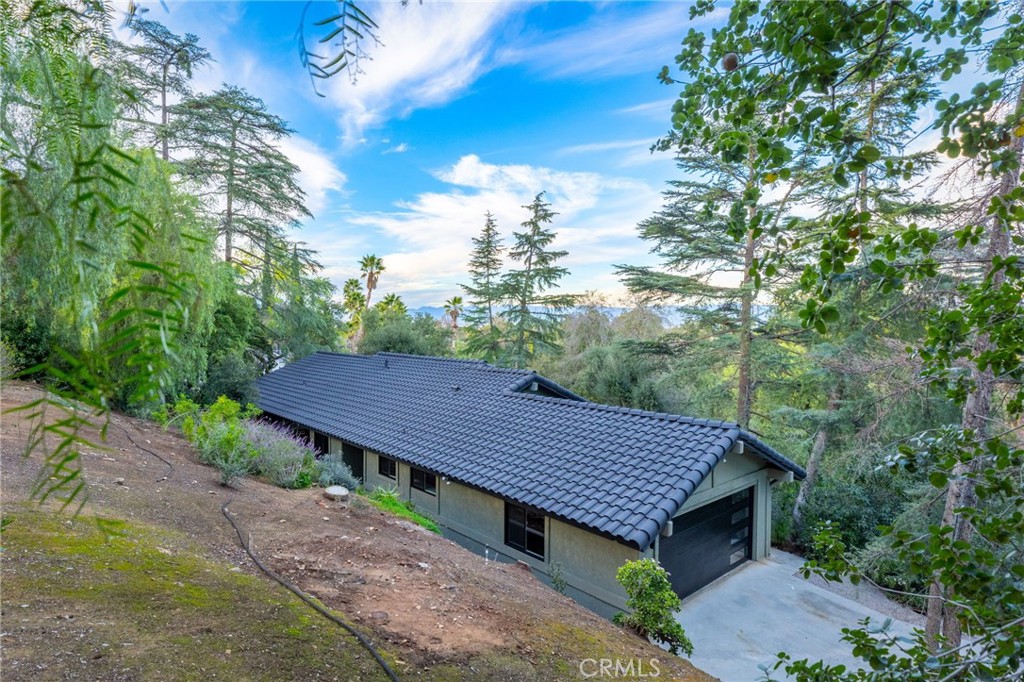 a view of a wooden deck and a backyard