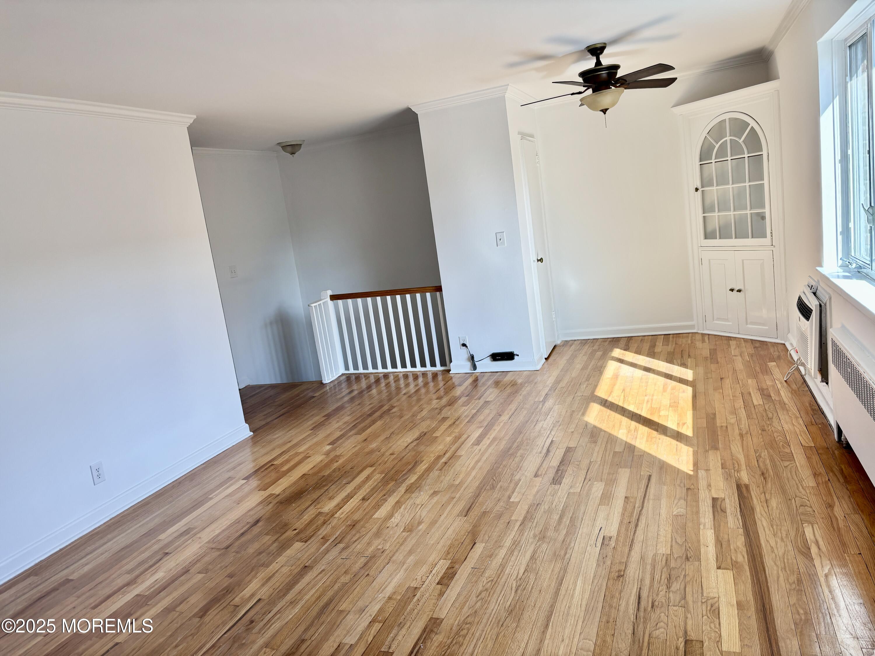 283 Spring Street, Unit 4C Red Bank, NJ 07701 - Photo 11 of 29 a view of a bedroom with wooden floor