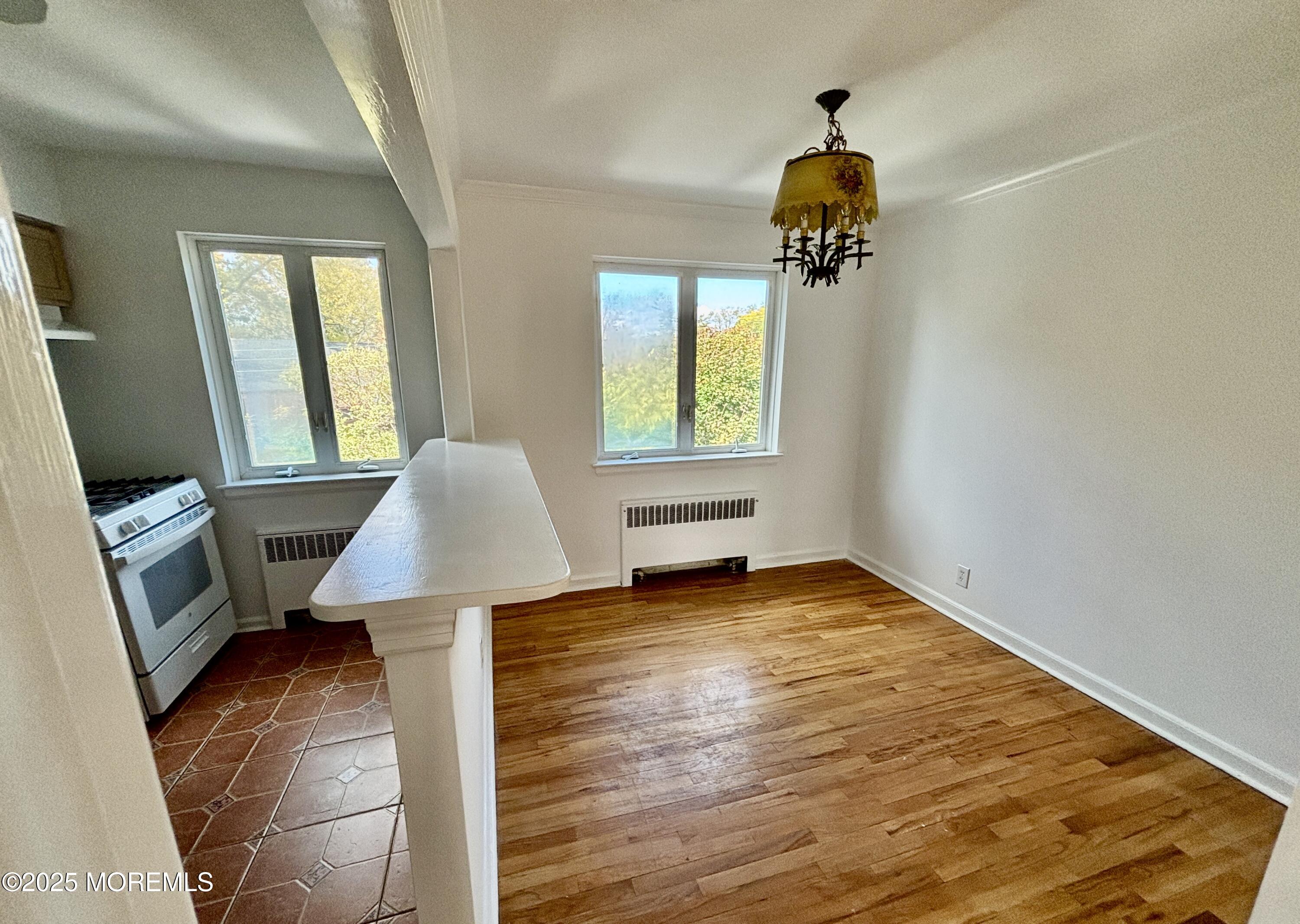 283 Spring Street, Unit 4C Red Bank, NJ 07701 - Photo 12 of 29 a view of a livingroom with furniture and a window