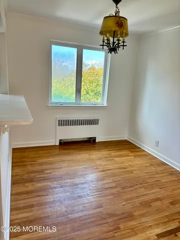 a view of a livingroom with furniture and a window