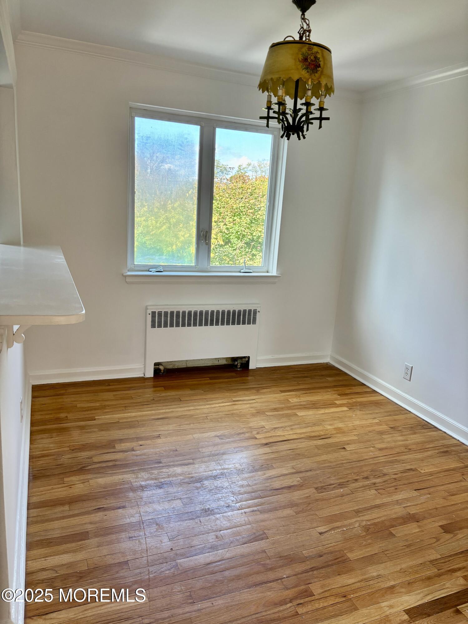 283 Spring Street, Unit 4C Red Bank, NJ 07701 - Photo 13 of 29 a view of a room with a window and a ceiling fan
