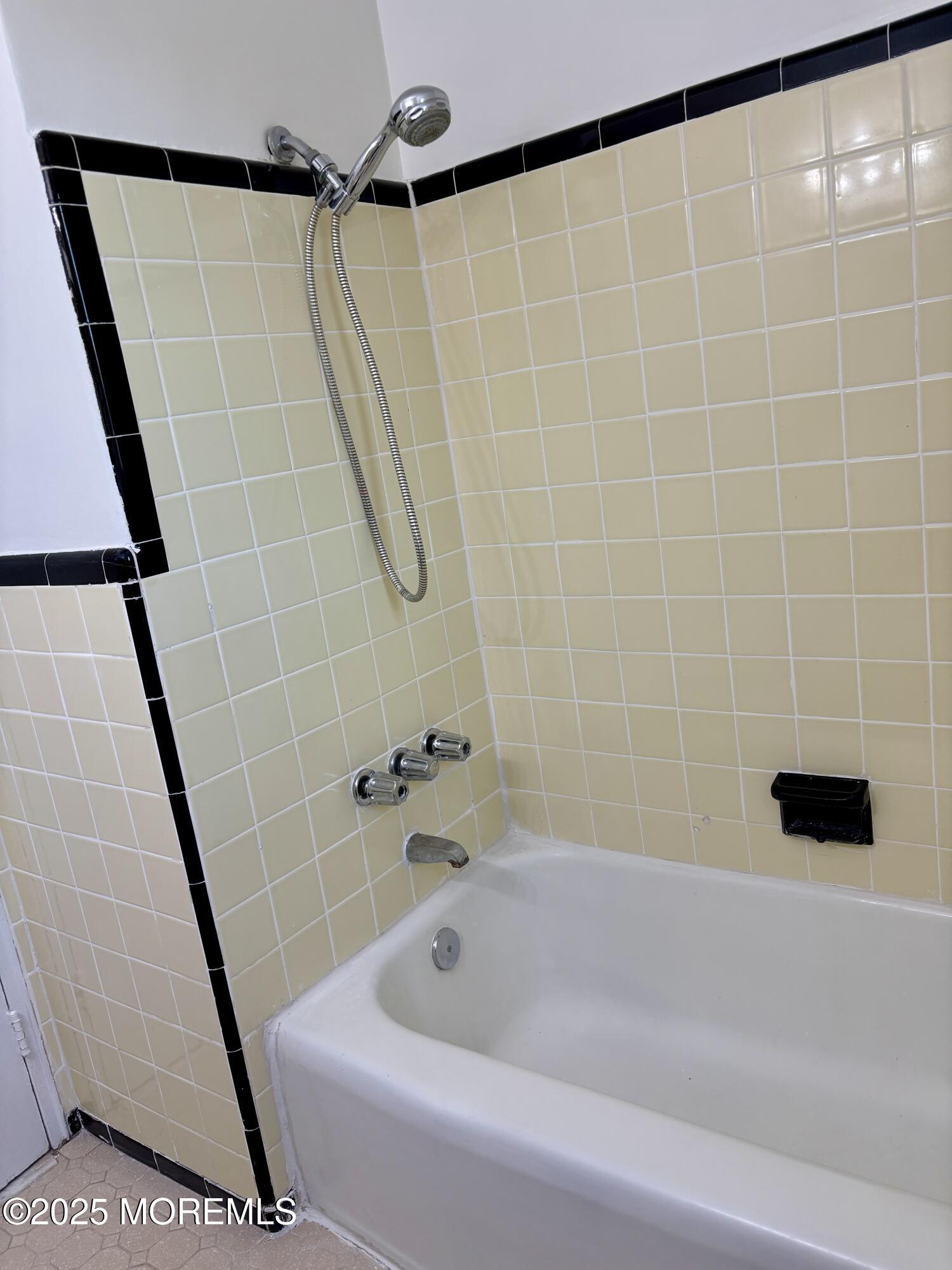 283 Spring Street, Unit 4C Red Bank, NJ 07701 - Photo 17 of 29 a bathroom with a bathtub