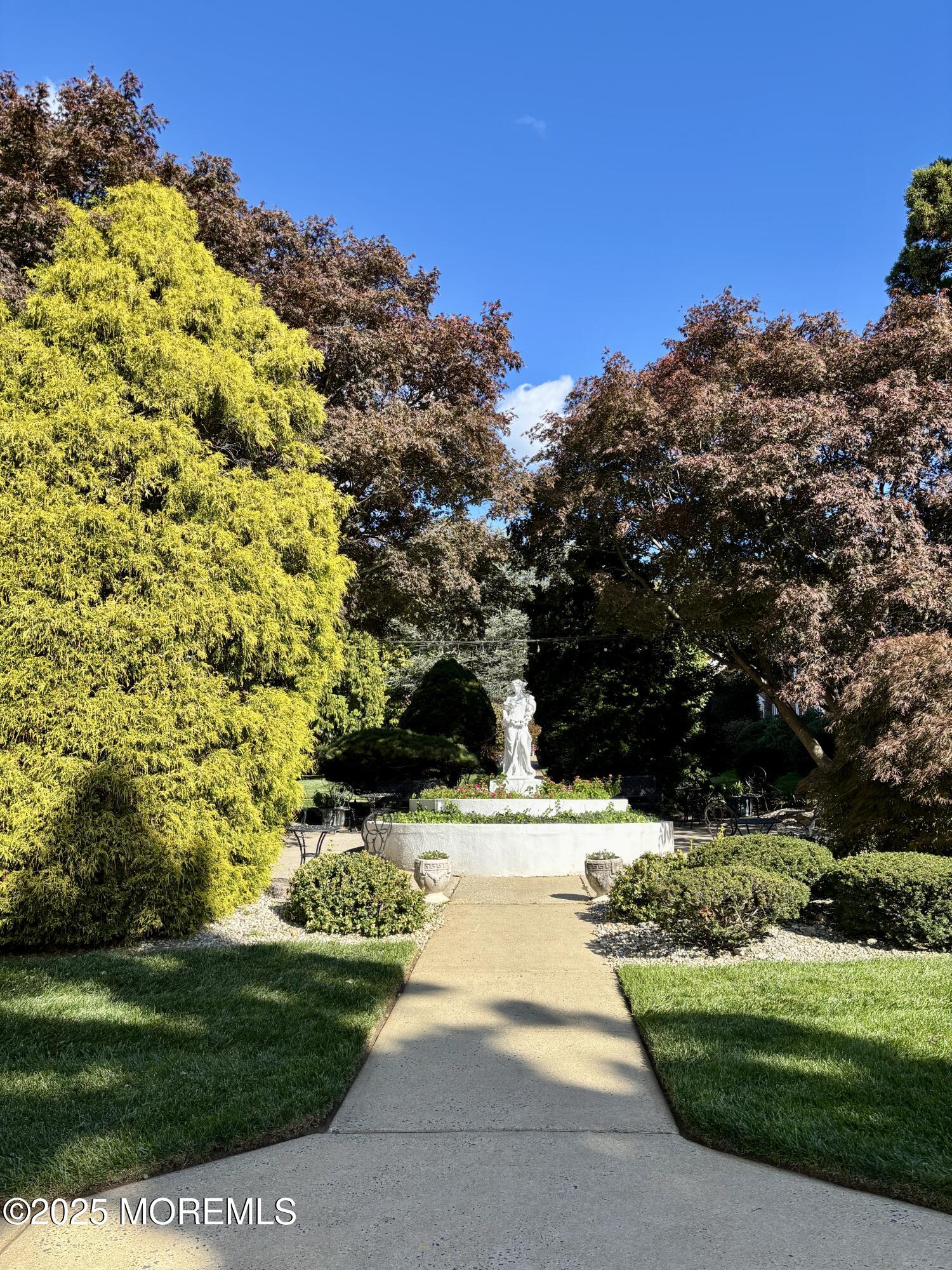 283 Spring Street, Unit 4C Red Bank, NJ 07701 - Photo 21 of 29 a view of a yard with yellow house