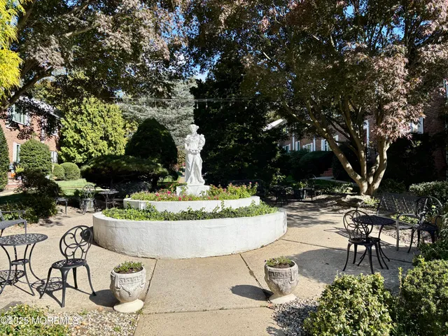 a view of a yard with yellow house