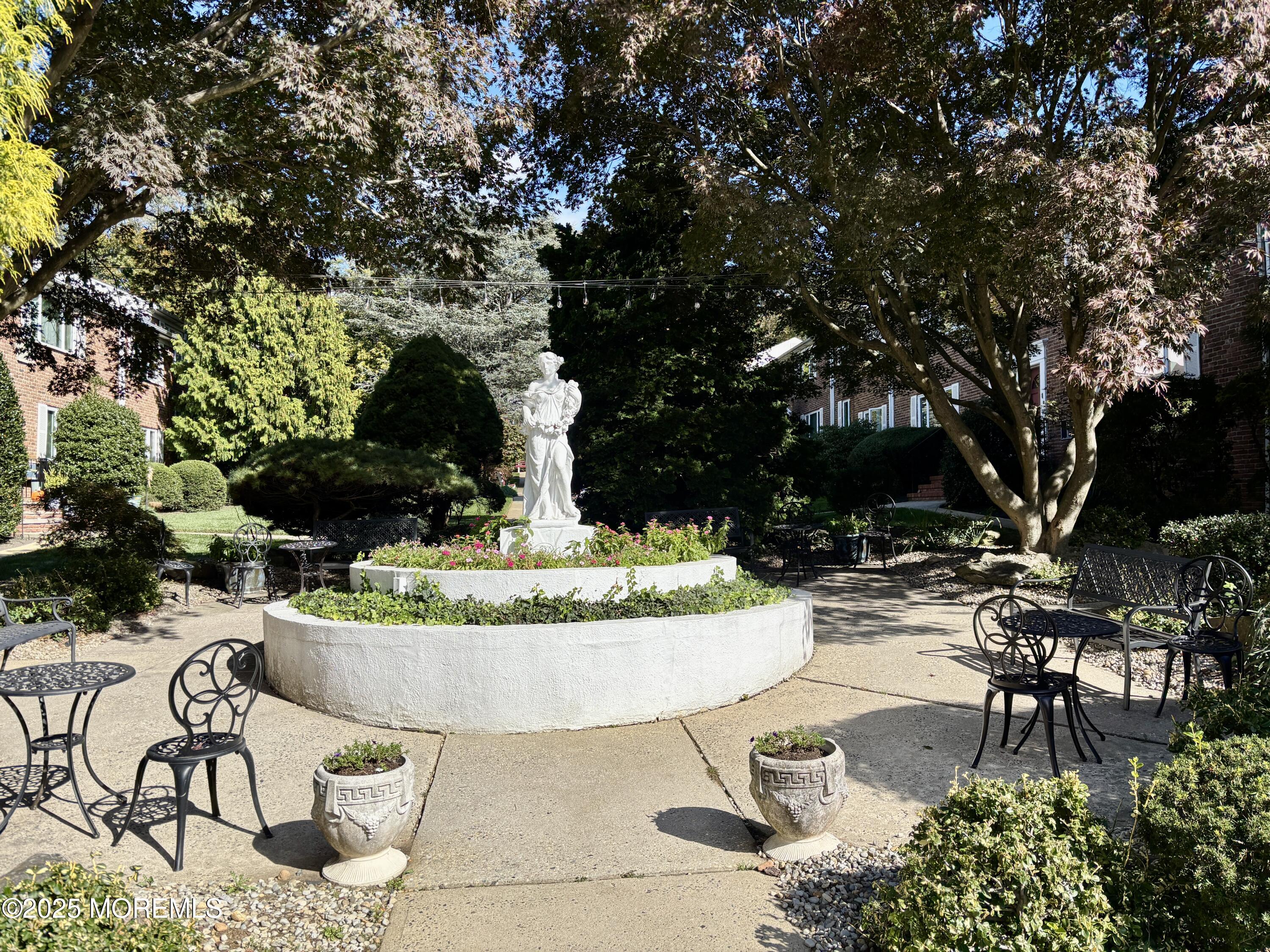 283 Spring Street, Unit 4C Red Bank, NJ 07701 - Photo 22 of 29 a view of a backyard with sitting area