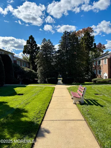 a view of a backyard with sitting area