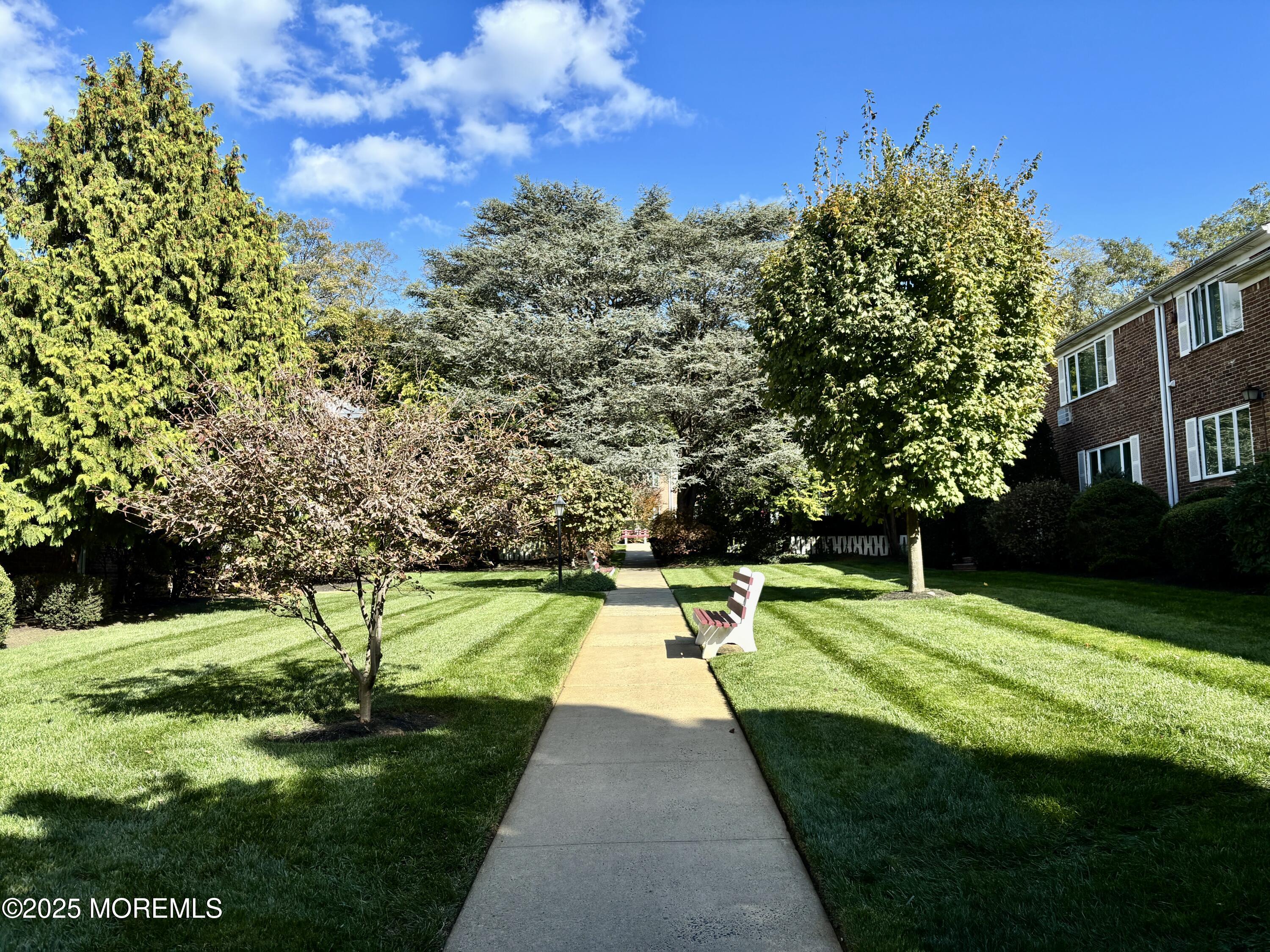 283 Spring Street, Unit 4C Red Bank, NJ 07701 - Photo 24 of 29 a view of swimming pool with a yard