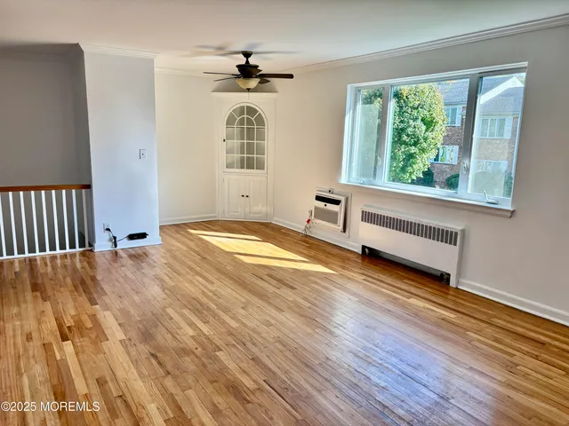 a kitchen with stainless steel appliances a stove a refrigerator and cabinets