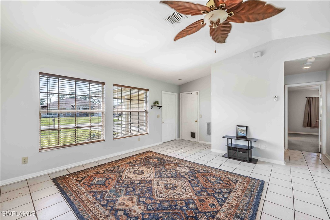 8457 Robin Road Fort Myers, FL 33967 - Photo 3 of 18 a living room with a rug