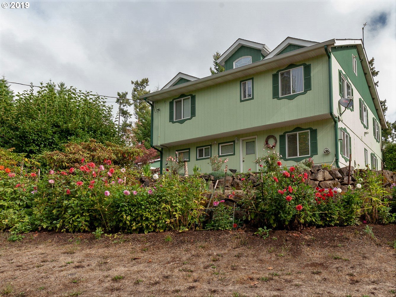 70740 Neer City Road Rainier, OR 97048 - Photo 1 of 21 a front view of a house with a yard