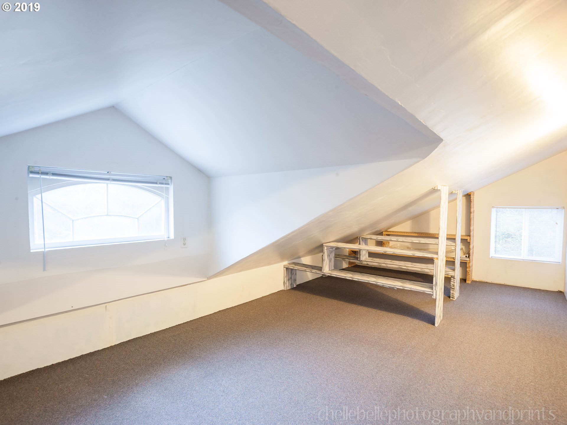 70740 Neer City Road Rainier, OR 97048 - Photo 7 of 21 an empty room with wooden floor and white walls