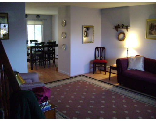 165 Manor Court, Unit 165 Springfield, MA 01118 - Photo 1 of 1 a living room with furniture and wooden floor