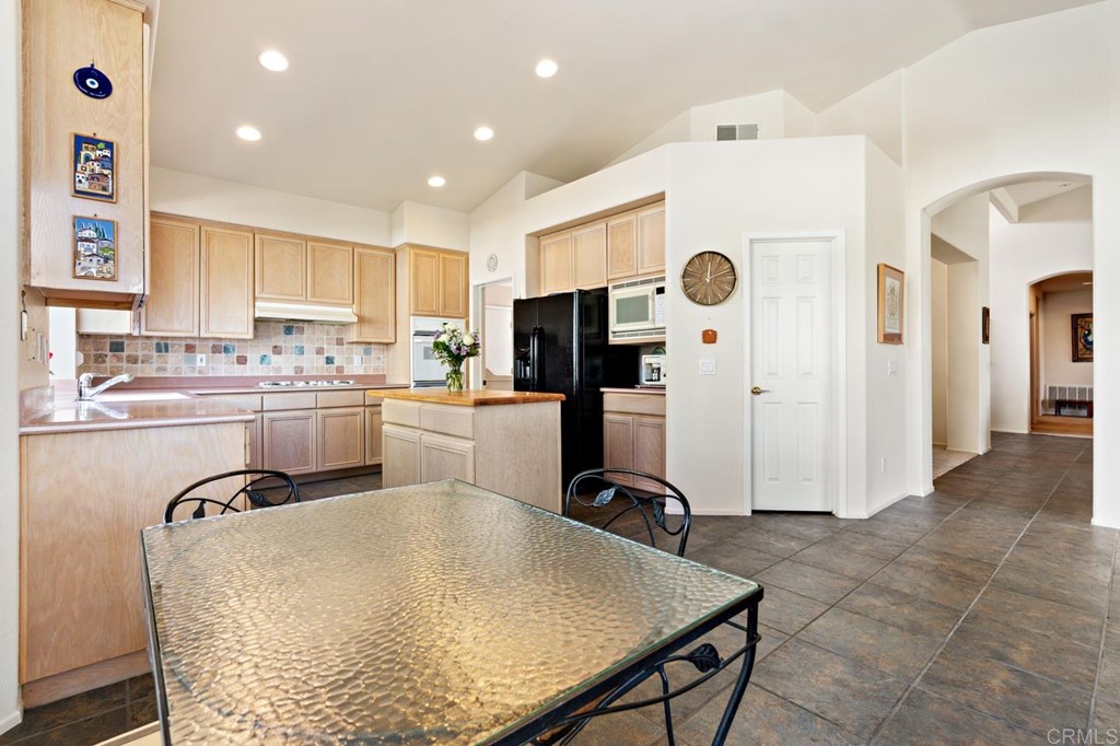 1667 Del Mar Road Oceanside, CA 92057 - Photo 15 of 51 a kitchen with kitchen island a counter top space appliances and cabinets