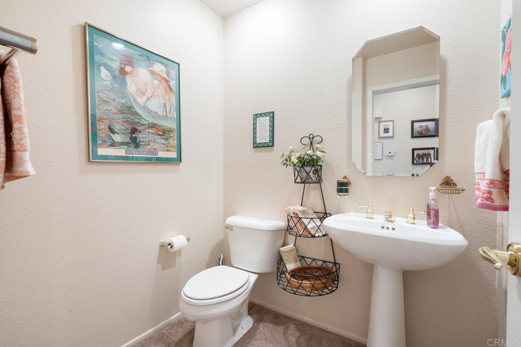 1667 Del Mar Road Oceanside, CA 92057 - Photo 21 of 51 a bathroom with a sink toilet and mirror