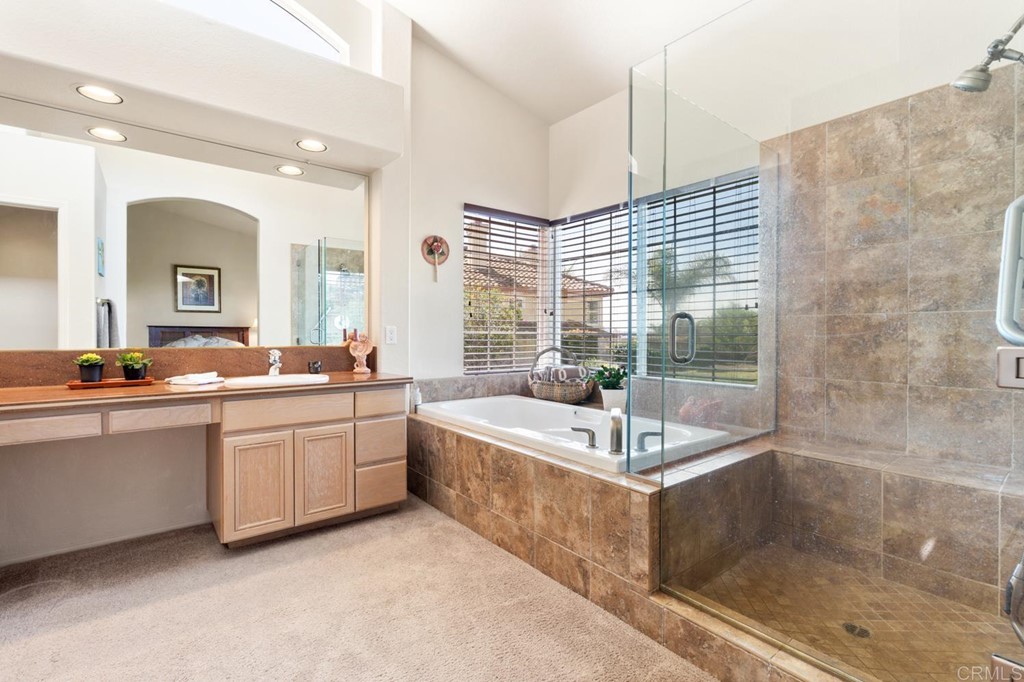 1667 Del Mar Road Oceanside, CA 92057 - Photo 24 of 51 a large spacious bathroom with a tub sink shower and mirror
