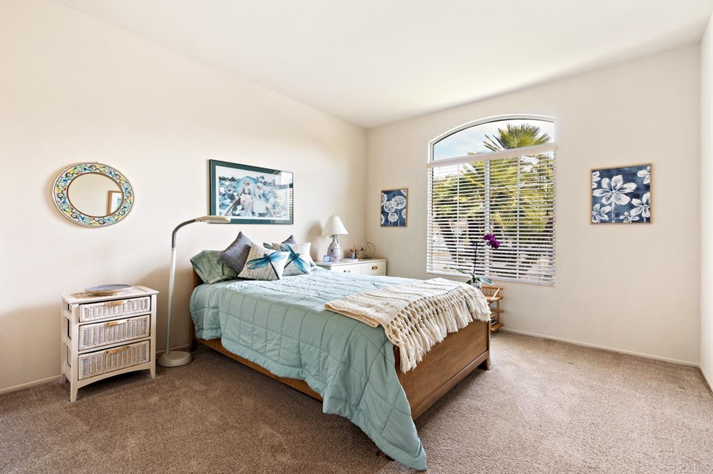 1667 Del Mar Road Oceanside, CA 92057 - Photo 26 of 51 a spacious bedroom with two beds and a window