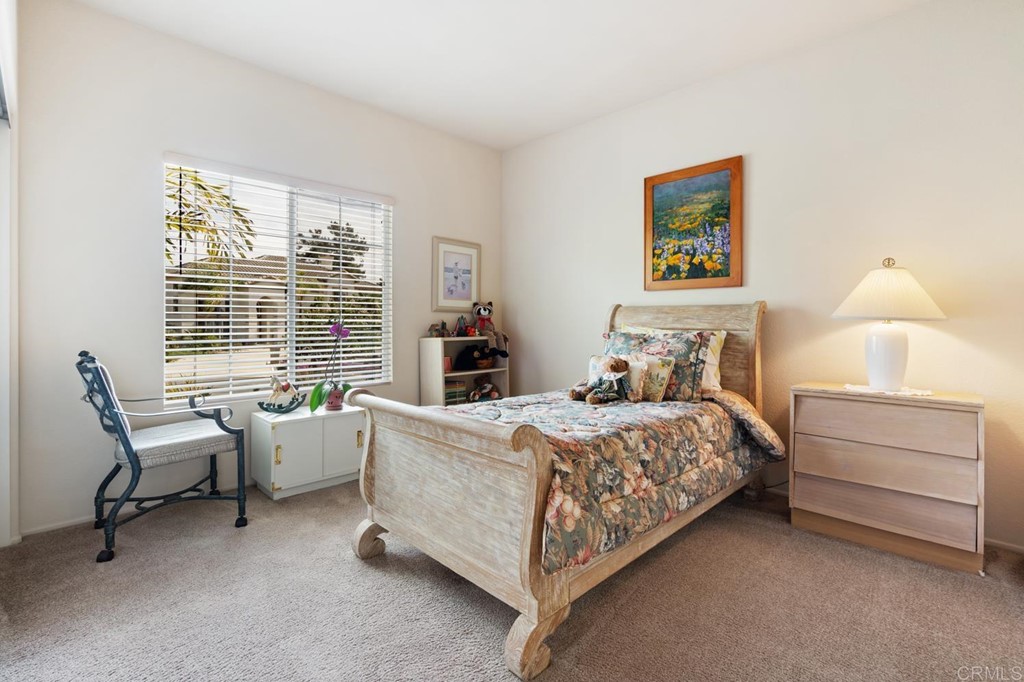 1667 Del Mar Road Oceanside, CA 92057 - Photo 28 of 51 a bedroom with a bed and a window