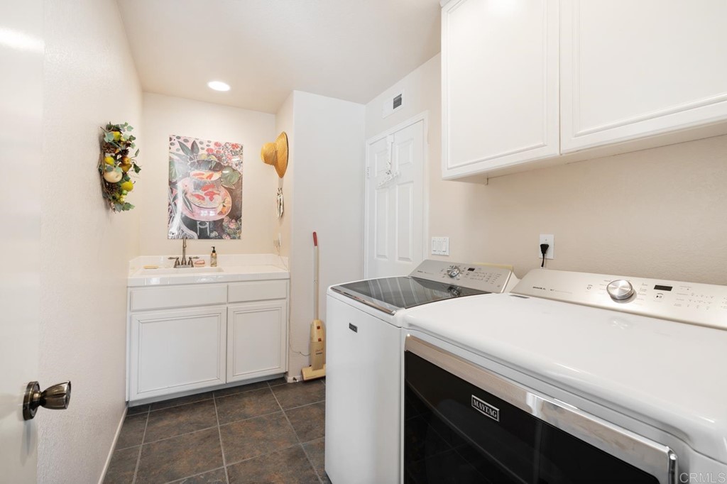 1667 Del Mar Road Oceanside, CA 92057 - Photo 30 of 51 a utility room with dryer and washer