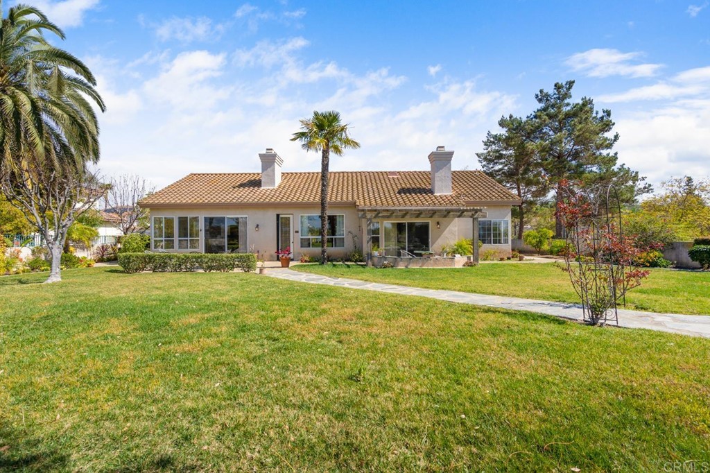 1667 Del Mar Road Oceanside, CA 92057 - Photo 31 of 51 a front view of a house with a yard