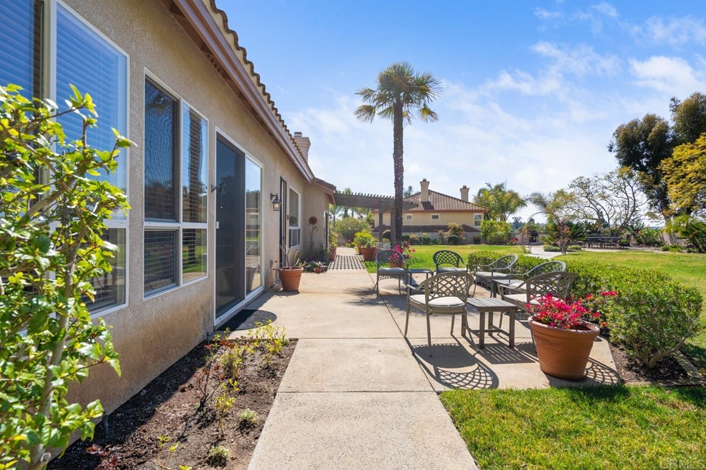1667 Del Mar Road Oceanside, CA 92057 - Photo 34 of 51 a view of a patio with a table and chairs