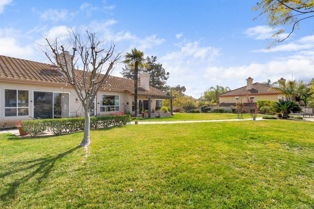 1667 Del Mar Road Oceanside, CA 92057 - Photo 36 of 51 a front view of a house with a yard