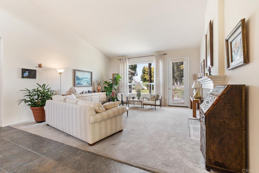 1667 Del Mar Road Oceanside, CA 92057 - Photo 7 of 51 a living room with furniture and a large window
