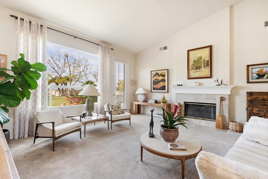 1667 Del Mar Road Oceanside, CA 92057 - Photo 8 of 51 a living room with furniture and a fireplace
