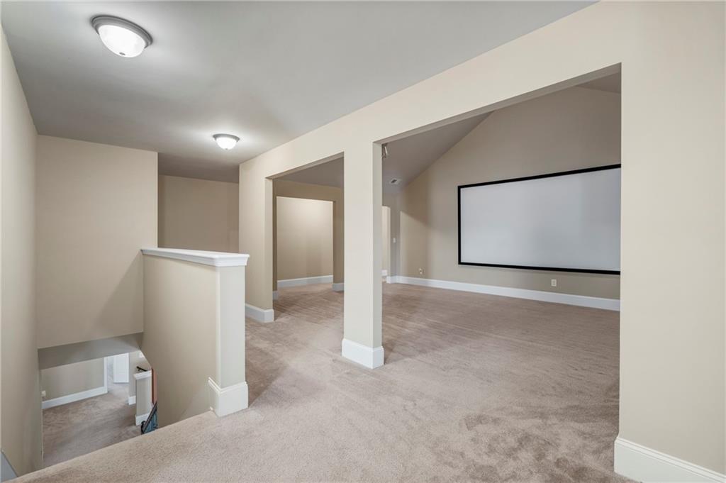 12 Juno Street Fort Mitchell, AL 36856 - Photo 32 of 43 Cinema room featuring light carpet and baseboards