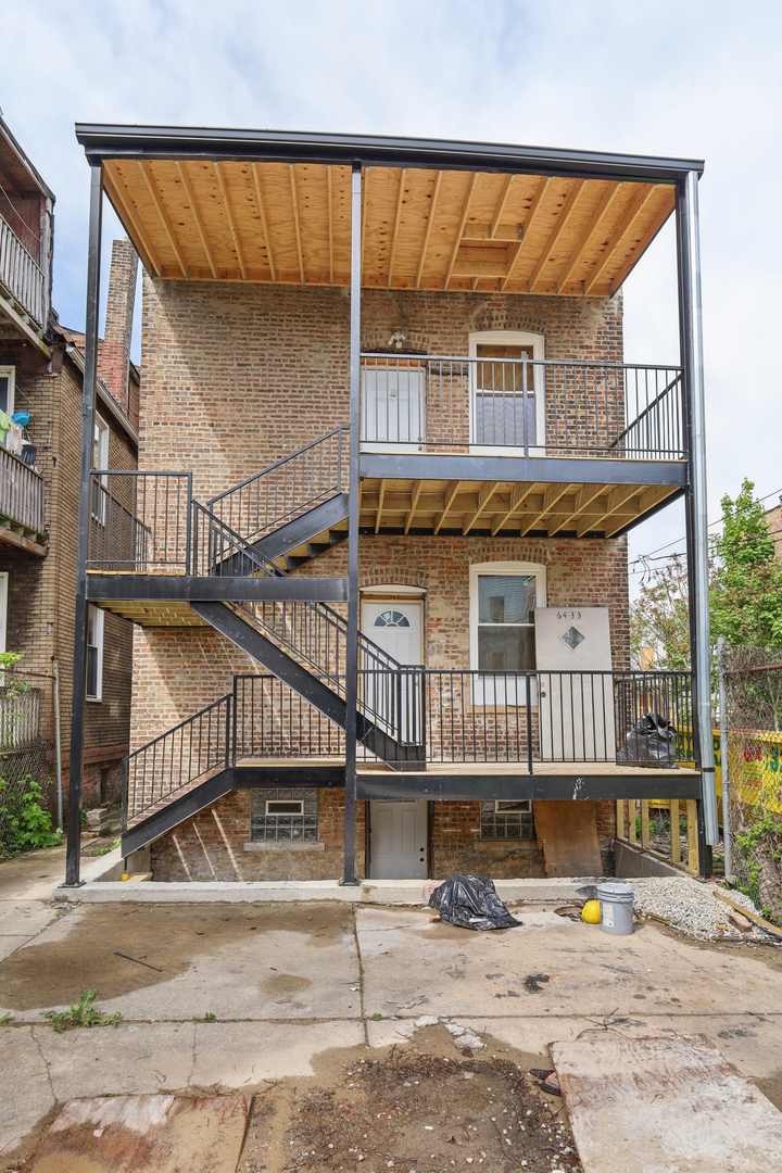 6433 South Sangamon Street Chicago, IL 60621 - Photo 19 of 26 front view of a house with a street