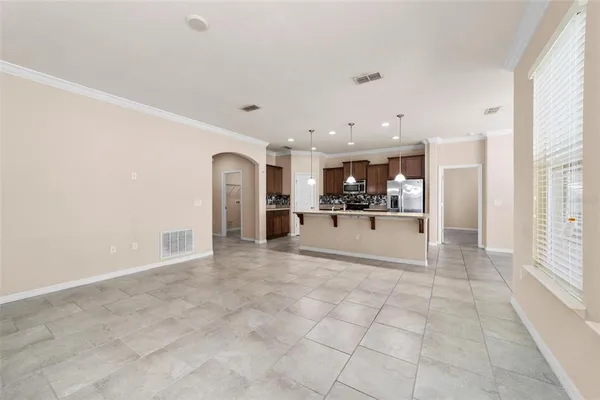 a view of a living room with a kitchen