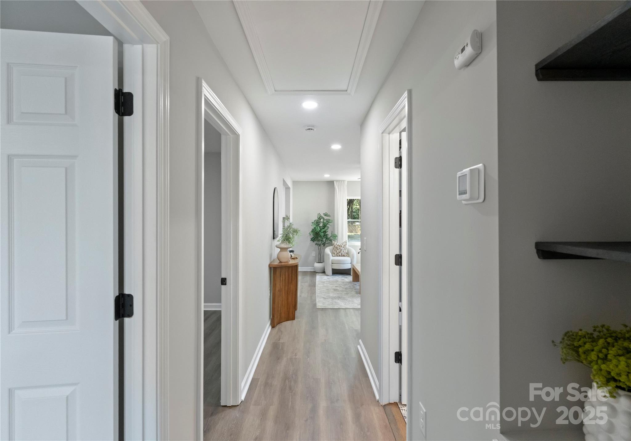 2900 Enfield Road Charlotte, NC 28205 - Photo 15 of 35 a view of hallway with livingroom and wooden floor