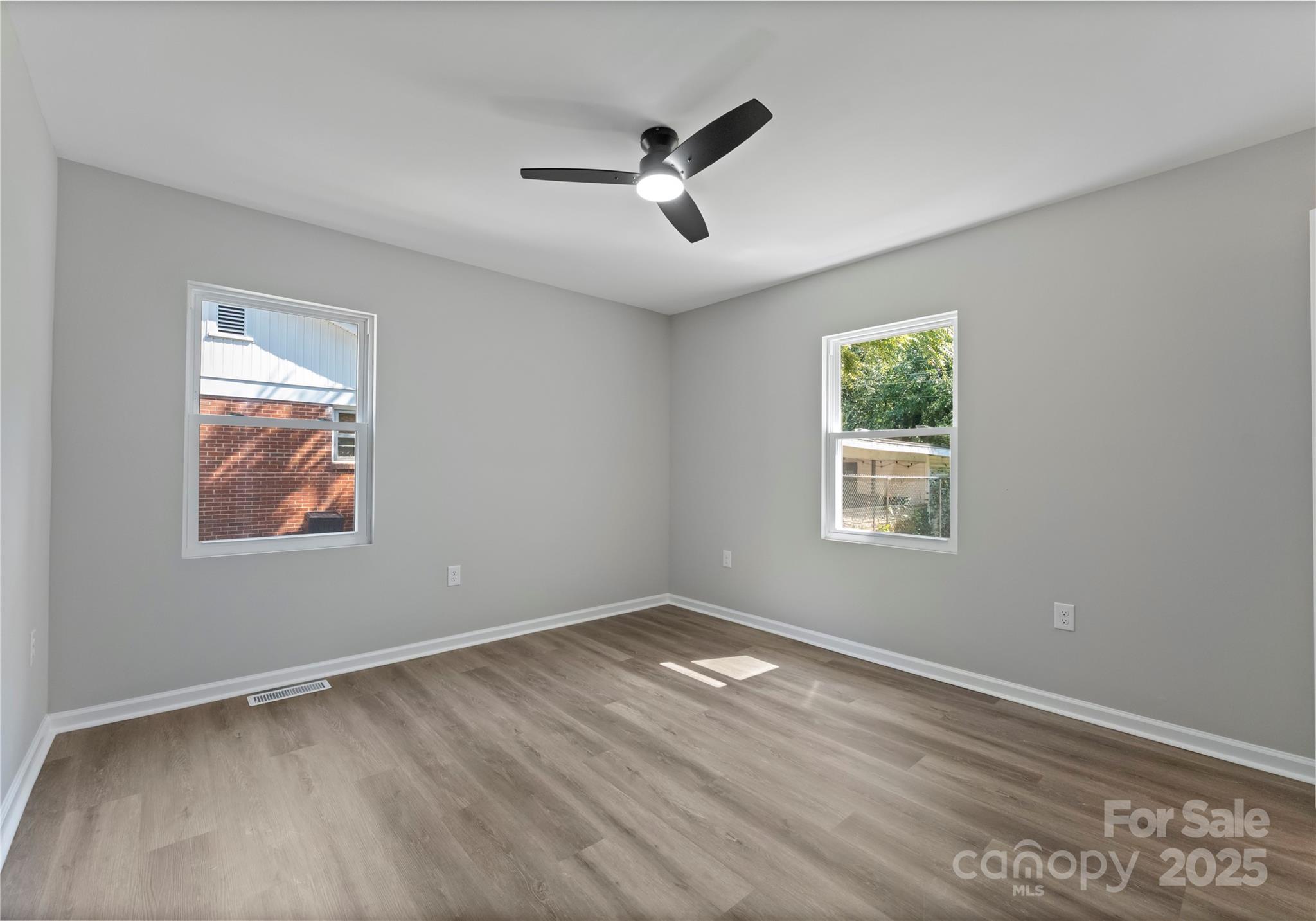 2900 Enfield Road Charlotte, NC 28205 - Photo 18 of 35 wooden floor in an empty room with a window